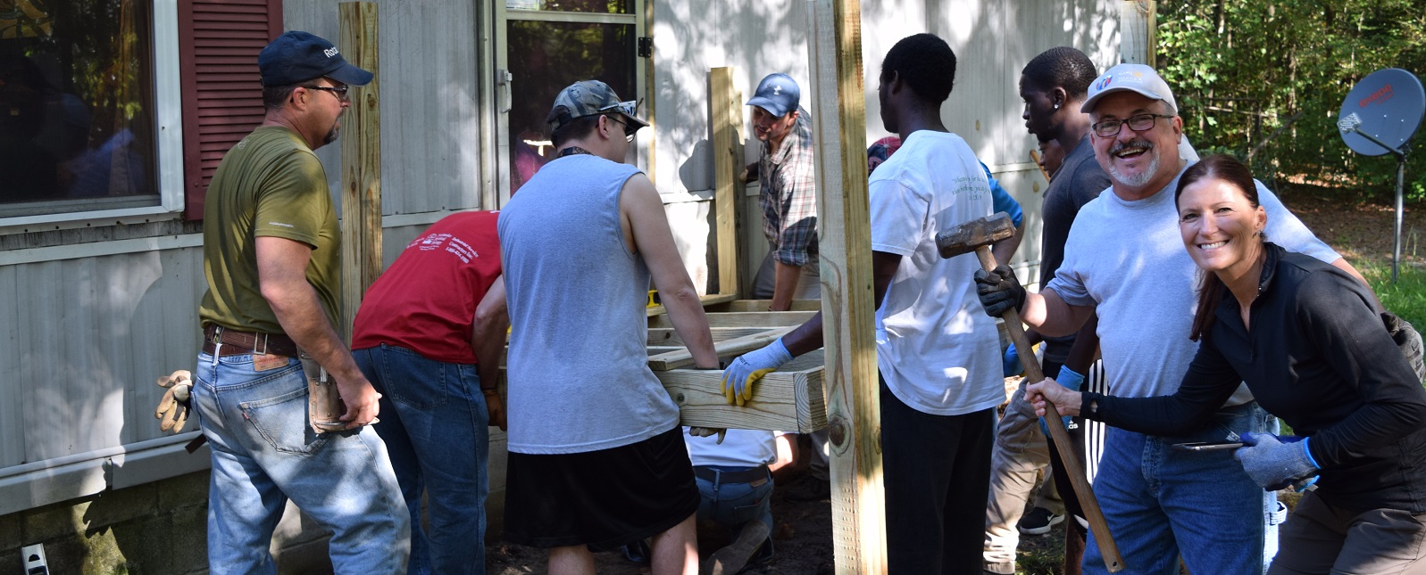 Volunteers work on a project for Chesapeake Housing Mission
